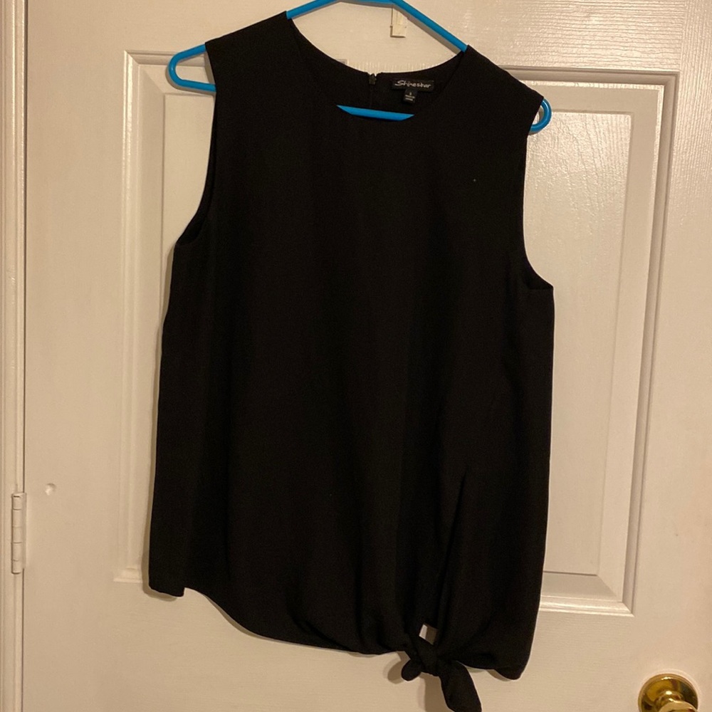 Black dress shirt no sleeves.